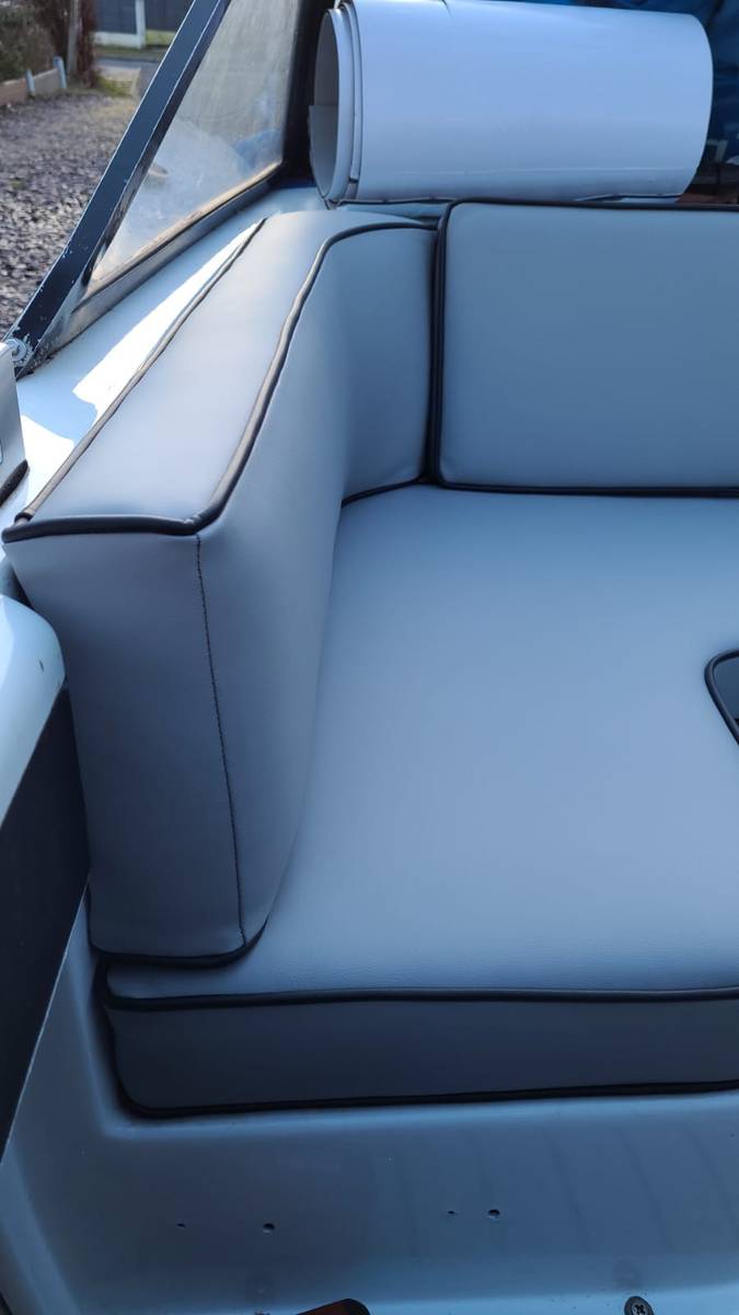 Close-up of new grey marine vinyl boat seating with black piping detail