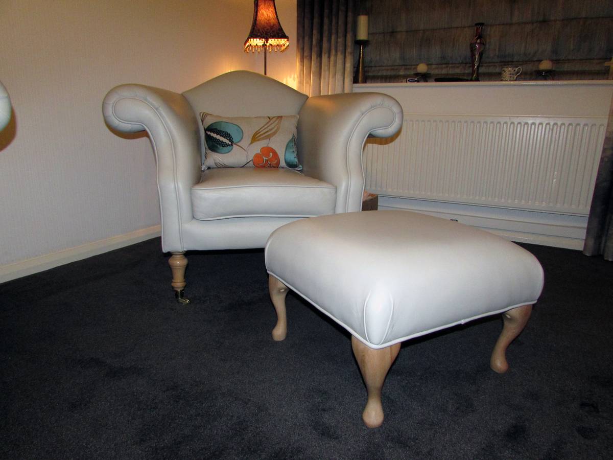 Cream leather tub chair with Queen Anne footstool