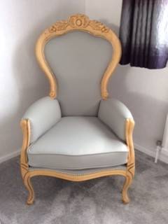 French-style ornate armchair in pale blue leather with carved gilt frame