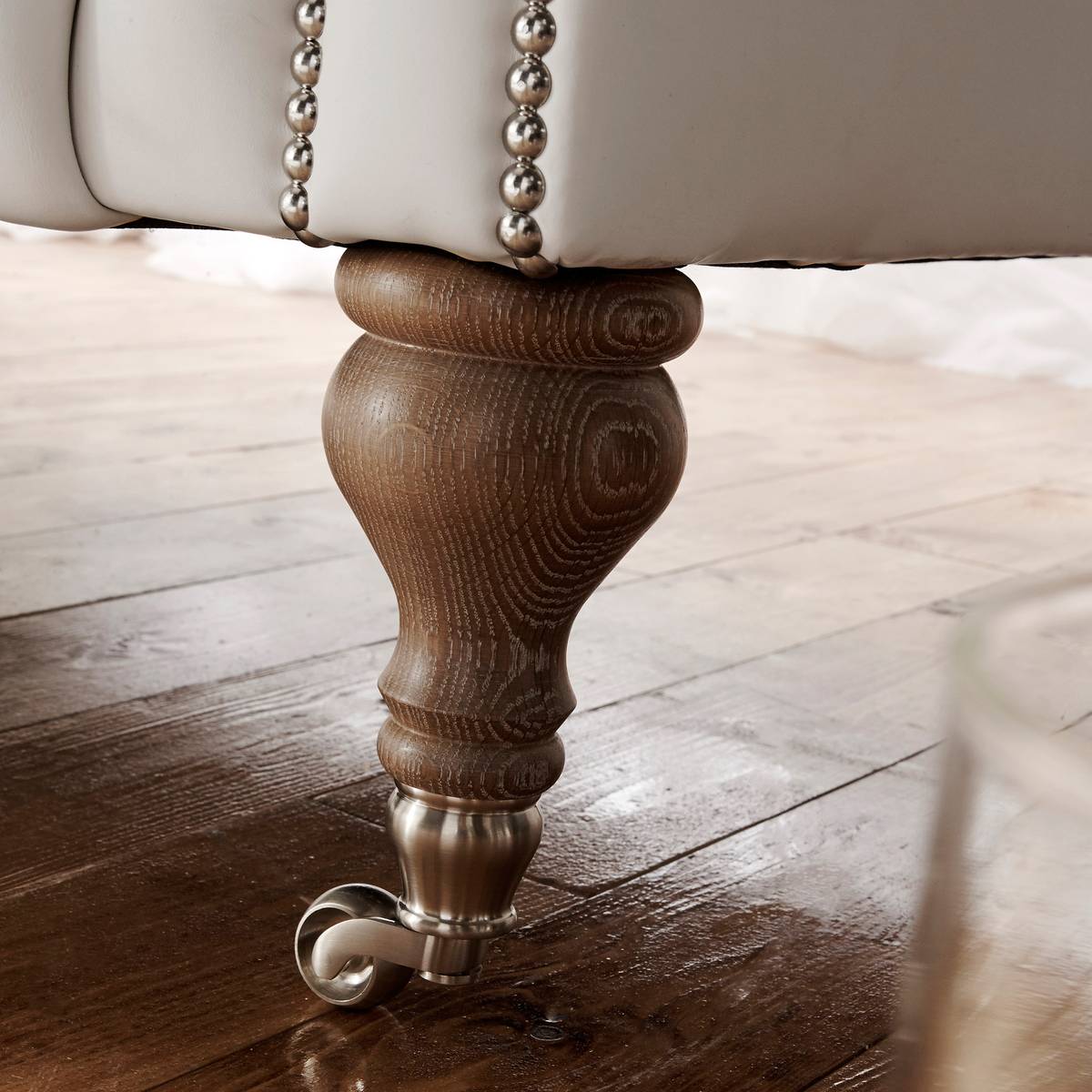 Turned wooden leg with chrome castor