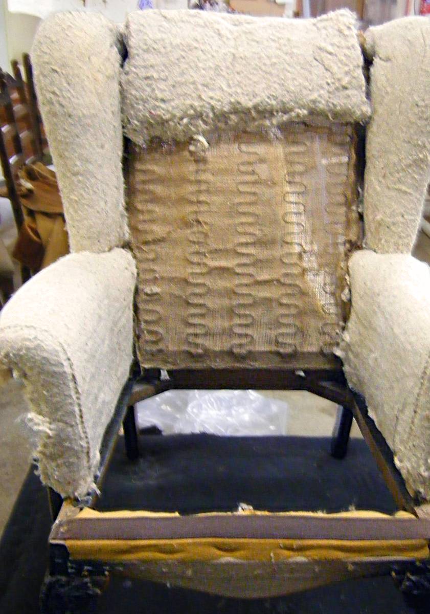 Armchair stripped to springs and hessian