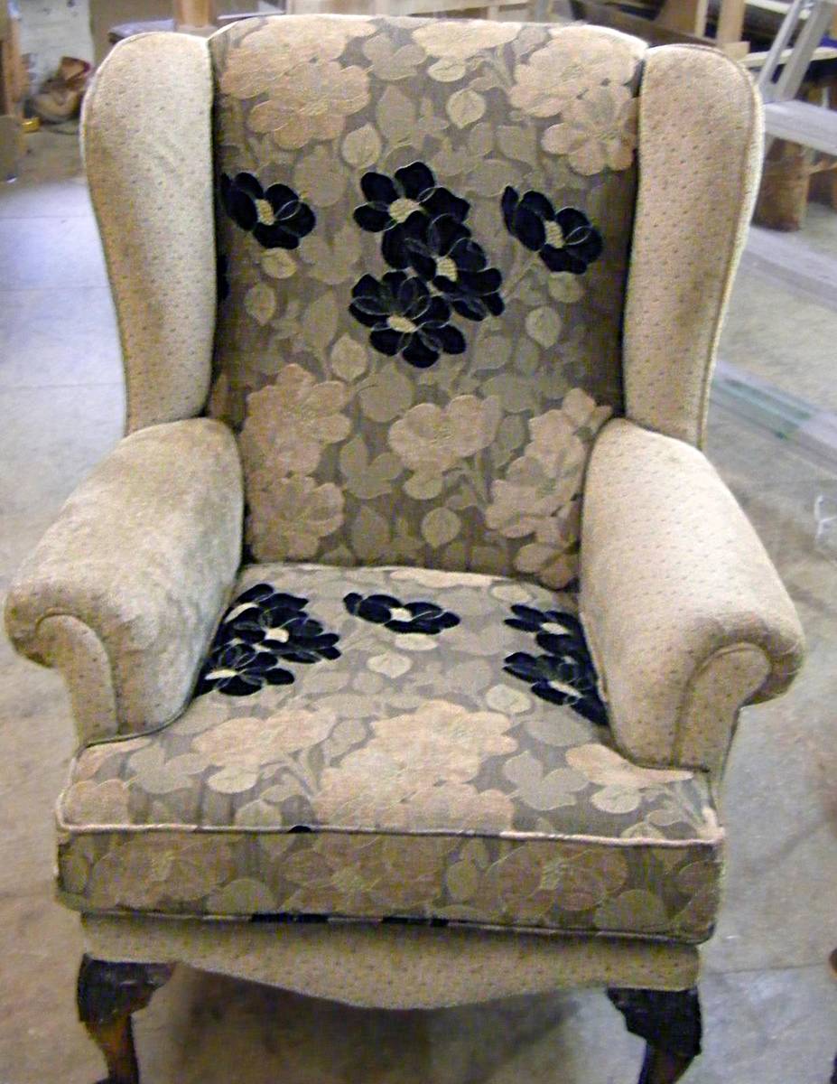 Completed wingback armchair in floral fabric